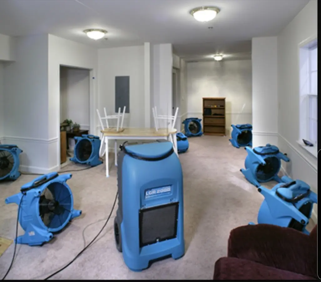 Air movers and dehumidifier setup for Water Damage Restoration in Pennfield